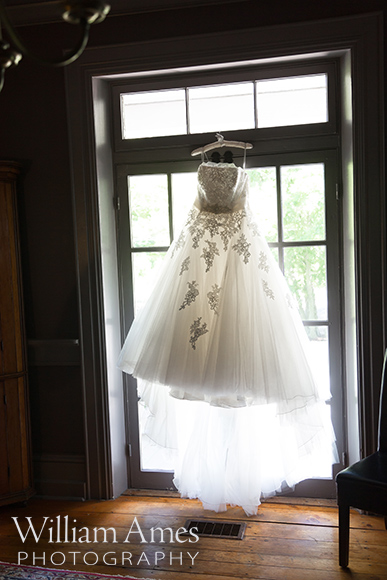 Wedding dress hanging in window
